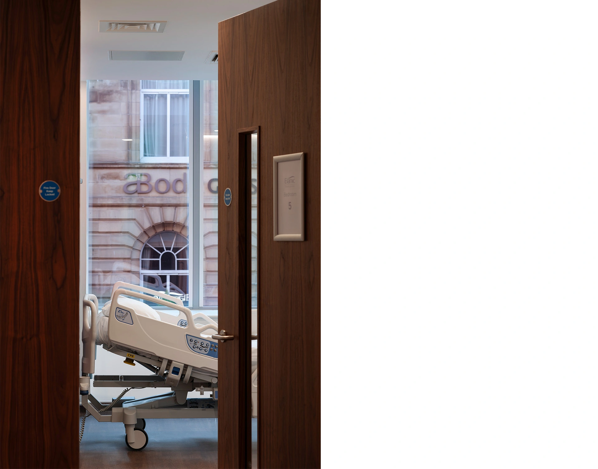 Recovery room view towards and across the tall glazing providing natural light and stunning views from inside towards Glasgow Bath Street.