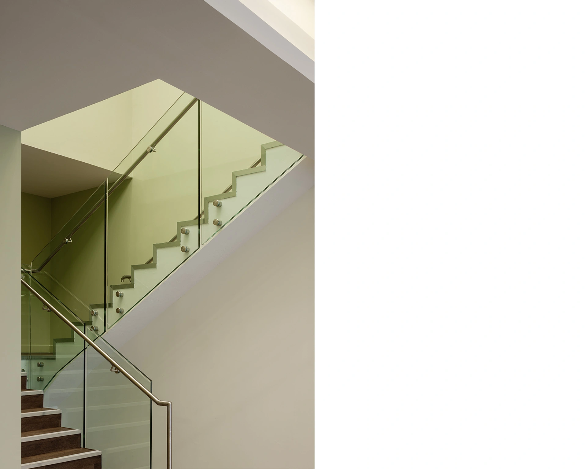 Award-winning healthcare architecture in Glasgow's Elanic Hospital glass handrail staircase.