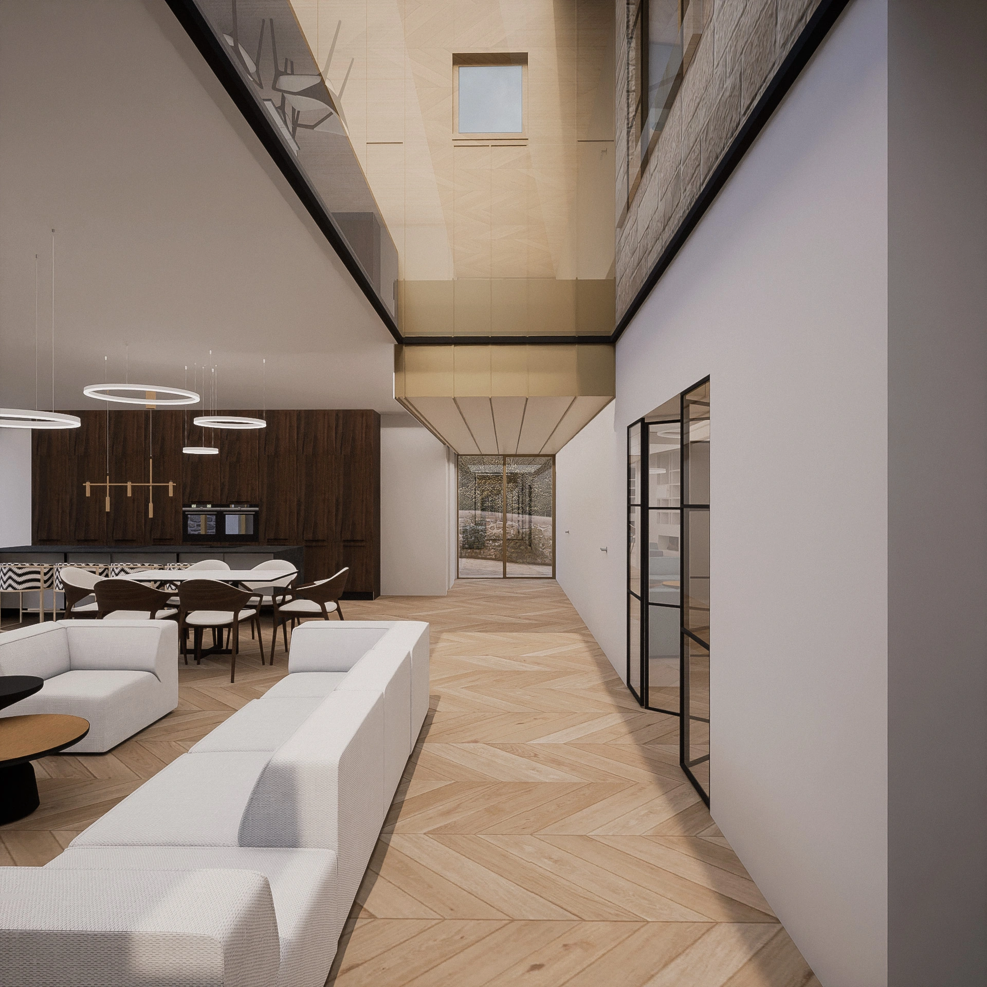 The interior of a contemporary home extension, with a frameless rooflight strip where the walls of the old and new build meet, bespoke lighting design, open-plan-living and dining space and a second storey dormitory, cladded in gold zinc.