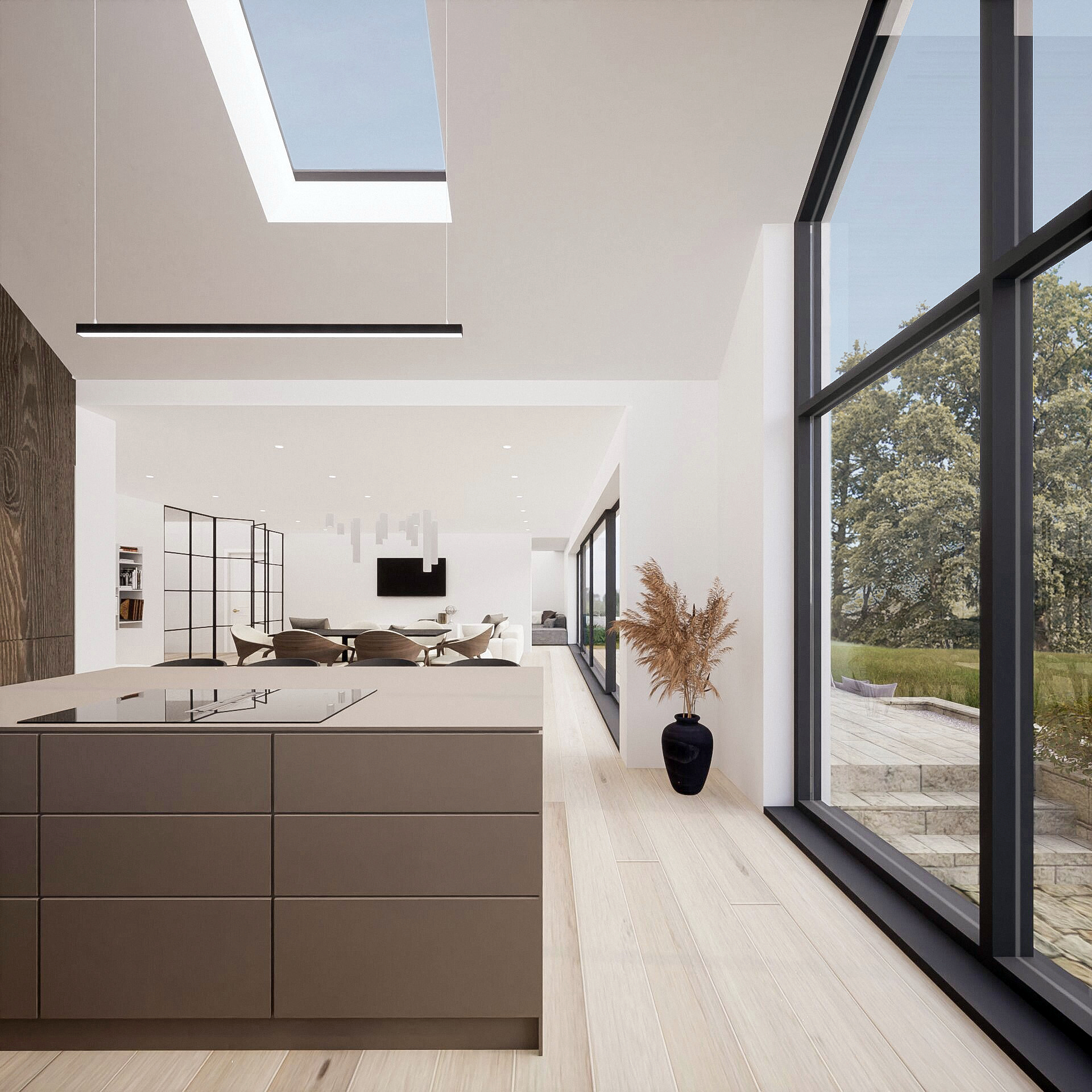 A spacious kitchen view with a kitchen island in the middle, a large window on the right showing views towards the spacious backyard, a rooflight directly above the kitchen island. The open-plan-living and dinning space is visible in the back with open spaces, floor-to-ceiling windows to make the space bright and welcoming, and bespoke lighting enhancing the modern contemporary feel of the house. This project was designed by NVDC residential home renovation architects in Glasgow, Scotland, UK. Located in Newton Mearns.